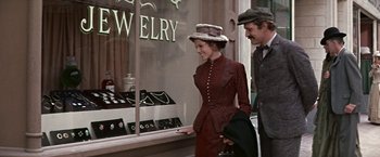 Movie still from “The Molly Maguires” (1970), directed by Martin Ritt – A man and a woman looking in a jewelry store window; Medium shot, Over the shoulder angle