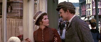 Movie still from “The Molly Maguires” (1970), directed by Martin Ritt – A man and a woman talking to each other outside; Medium shot, Low angle