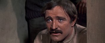 Movie still from “The Molly Maguires” (1970), directed by Martin Ritt – A person with a mustache; Close Up shot, High angle