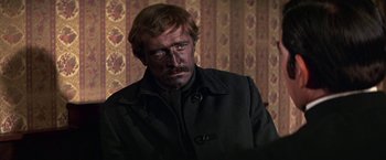 Movie still from “The Molly Maguires” (1970), directed by Martin Ritt – A person wearing a jacket; Close Up shot, Over the shoulder angle