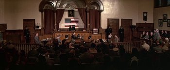 Movie still from “The Molly Maguires” (1970), directed by Martin Ritt – A crowd of people sitting in a court room; Extreme Wide shot, High angle