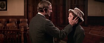 Movie still from “The Molly Maguires” (1970), directed by Martin Ritt – An older man and woman in a suit and tie; Close Up shot, Over the shoulder angle