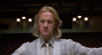 Movie still from “The Money Pit” (1986), directed by Richard Benjamin – A person with long blonde hair; Close Up shot, Low angle