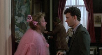 Movie still from “The Money Pit” (1986), directed by Richard Benjamin – Two people in a room talking to each other; Medium shot, Over the shoulder angle