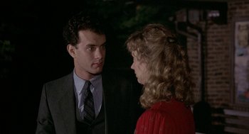 Movie still from “The Money Pit” (1986), directed by Richard Benjamin – A man and a woman talking to each other; Close Up shot, Over the shoulder angle