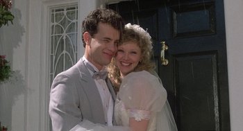 Movie still from “The Money Pit” (1986), directed by Richard Benjamin – A man and a woman posing for a picture; Close Up shot, Low angle