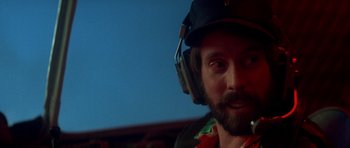 Movie still from “The Monster Squad” (1987), directed by Fred Dekker – A man with a beard wearing a helmet and ear muffs; Close Up shot, Low angle