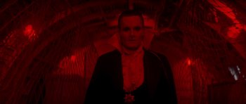 Movie still from “The Monster Squad” (1987), directed by Fred Dekker – A man wearing a black robe and a red cape; Medium shot, Low angle