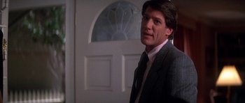 Movie still from “The Monster Squad” (1987), directed by Fred Dekker – A person standing in front of a door; Close Up shot, Low angle
