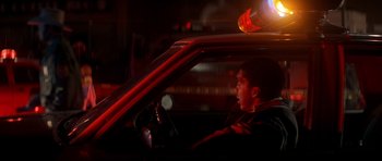 Movie still from “The Monster Squad” (1987), directed by Fred Dekker – A man driving a car in the dark at night; Medium shot, Low angle