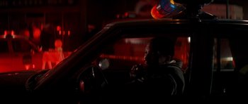 Movie still from “The Monster Squad” (1987), directed by Fred Dekker – A man sitting in the driver's seat of a car at night; Close Up shot, Low angle