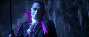 Movie still from “The Monster Squad” (1987), directed by Fred Dekker – A person wearing a dracula costume; Close Up shot, Low angle