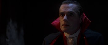 Movie still from “The Monster Squad” (1987), directed by Fred Dekker – A person wearing a dracula costume; Close Up shot, Low angle
