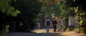Movie still from “The Monster Squad” (1987), directed by Fred Dekker – A group of people walking down a sidewalk; Wide shot, Low angle