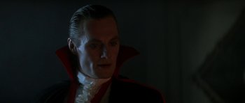 Movie still from “The Monster Squad” (1987), directed by Fred Dekker – A person wearing a dracula costume; Close Up shot, Low angle
