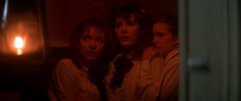 Movie still from “The Monster Squad” (1987), directed by Fred Dekker – A group of three women standing next to each other; Medium shot, Low angle
