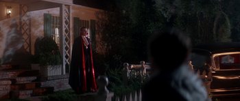 Movie still from “The Monster Squad” (1987), directed by Fred Dekker – A man dressed as a vampire standing in front of a house; Wide shot, Low angle