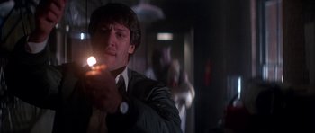 Movie still from “The Monster Squad” (1987), directed by Fred Dekker – A man holding a lit candle in a dark room; Close Up shot, Low angle