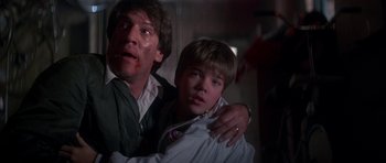 Movie still from “The Monster Squad” (1987), directed by Fred Dekker – A man and a boy with blood on their face; Close Up shot, Low angle