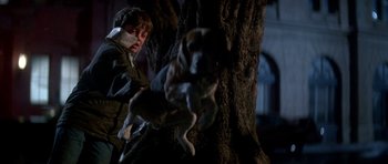 Movie still from “The Monster Squad” (1987), directed by Fred Dekker – A man and a dog in a tree; Medium shot, Low angle