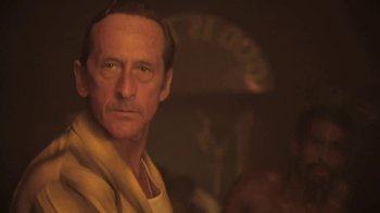 Movie still from “The Mosquito Coast” (1986), directed by Peter Weir – A person wearing a yellow shirt; Close Up shot, Low angle