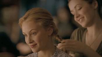Movie still from “The Moth Diaries” (2011), directed by Mary Harron – A woman is getting her hair done by a stylist; Close Up shot, Over the shoulder angle