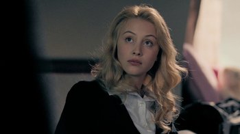 Movie still from “The Moth Diaries” (2011), directed by Mary Harron – A beautiful young lady sitting in front of a mirror; Close Up shot, Over the shoulder angle