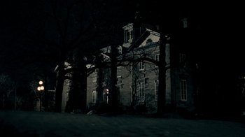 Movie still from “The Moth Diaries” (2011), directed by Mary Harron – A dark picture of an old house in the dark; Extreme Wide shot, Low angle