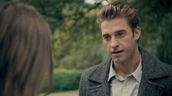 Movie still from “The Moth Diaries” (2011), directed by Mary Harron – A man in a gray jacket talking to a woman in a white shirt; Close Up shot, Over the shoulder angle