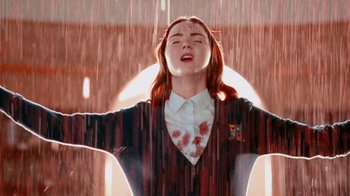 Movie still from “The Moth Diaries” (2011), directed by Mary Harron – A woman with blood all over her face and hands in the air; Close Up shot, Low angle