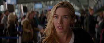 Movie still from “The Mountain Between Us” (2017), directed by Hany Abu-Assad – A person with long blonde hair; Close Up shot, Over the shoulder angle