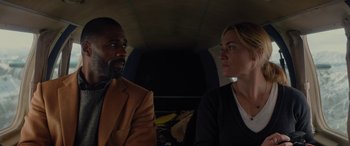 Movie still from “The Mountain Between Us” (2017), directed by Hany Abu-Assad – A man and a woman sitting next to each other in a bus; Close Up shot, Low angle
