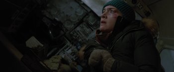 Movie still from “The Mountain Between Us” (2017), directed by Hany Abu-Assad – A person with a cell phone in their hand; Close Up shot, Low angle