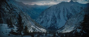 Movie still from “The Mountain Between Us” (2017), directed by Hany Abu-Assad – A view of a mountain range with snow on it's slopes; Extreme Wide shot, High angle
