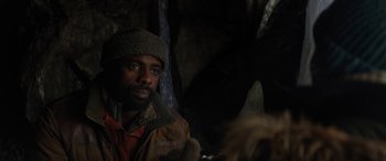 Movie still from “The Mountain Between Us” (2017), directed by Hany Abu-Assad – A man wearing a brown jacket and a hat; Close Up shot, Over the shoulder angle