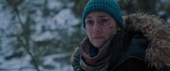Movie still from “The Mountain Between Us” (2017), directed by Hany Abu-Assad – A woman in a blue hat and a scarf; Close Up shot, Over the shoulder angle