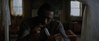 Movie still from “The Mountain Between Us” (2017), directed by Hany Abu-Assad – A man holding a toothbrush in his mouth; Close Up shot, High angle
