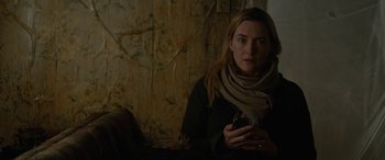 Movie still from “The Mountain Between Us” (2017), directed by Hany Abu-Assad – A woman with a cell phone in her hand; Close Up shot, Over the shoulder angle