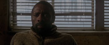 Movie still from “The Mountain Between Us” (2017), directed by Hany Abu-Assad – A person wearing a jacket near a window; Close Up shot, Low angle