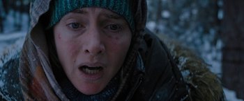 Movie still from “The Mountain Between Us” (2017), directed by Hany Abu-Assad – A person wearing a jacket and a hat; Close Up shot, Low angle