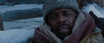 Movie still from “The Mountain Between Us” (2017), directed by Hany Abu-Assad – A person wearing a hat and a scarf; Close Up shot, Low angle