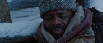 Movie still from “The Mountain Between Us” (2017), directed by Hany Abu-Assad – A person wearing a jacket and hat; Close Up shot, High angle
