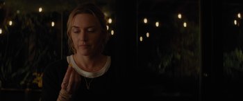 Movie still from “The Mountain Between Us” (2017), directed by Hany Abu-Assad – A beautiful woman standing in front of a mirror; Close Up shot, Over the shoulder angle