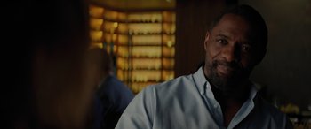 Movie still from “The Mountain Between Us” (2017), directed by Hany Abu-Assad – A person sitting in a room; Close Up shot, Over the shoulder angle