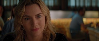 Movie still from “The Mountain Between Us” (2017), directed by Hany Abu-Assad – A woman with blonde hair and blue eyes; Close Up shot, Over the shoulder angle