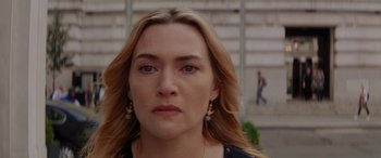 Movie still from “The Mountain Between Us” (2017), directed by Hany Abu-Assad – A person with long blonde hair; Close Up shot, Over the shoulder angle