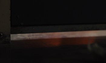 Movie still from “The Mustang” (2019), directed by Laure de Clermont-Tonnerre – A blurry picture of a knife in the dark; Extreme Close Up shot, High angle