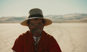 Movie still from “The Mustang” (2019), directed by Laure de Clermont-Tonnerre – An old man with a beard and a hat; Close Up shot, Low angle