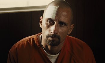 Movie still from “The Mustang” (2019), directed by Laure de Clermont-Tonnerre – A man with bandages on his head and face; Close Up shot, Over the shoulder angle