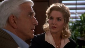 Movie still from “Naked Gun 33 1/3: The Final Insult” (1994), directed by Peter Segal – A man and a woman talking to each other; Close Up shot, Over the shoulder angle